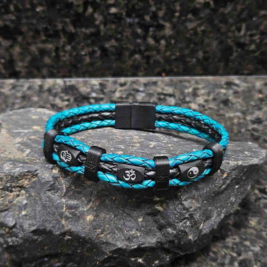 Mantra · Banded Leather in Turquoise: turquoise leather outer braids · black centre braid · black beads · white hamsa, om + yin yang · black bands · black slide-lock clasp