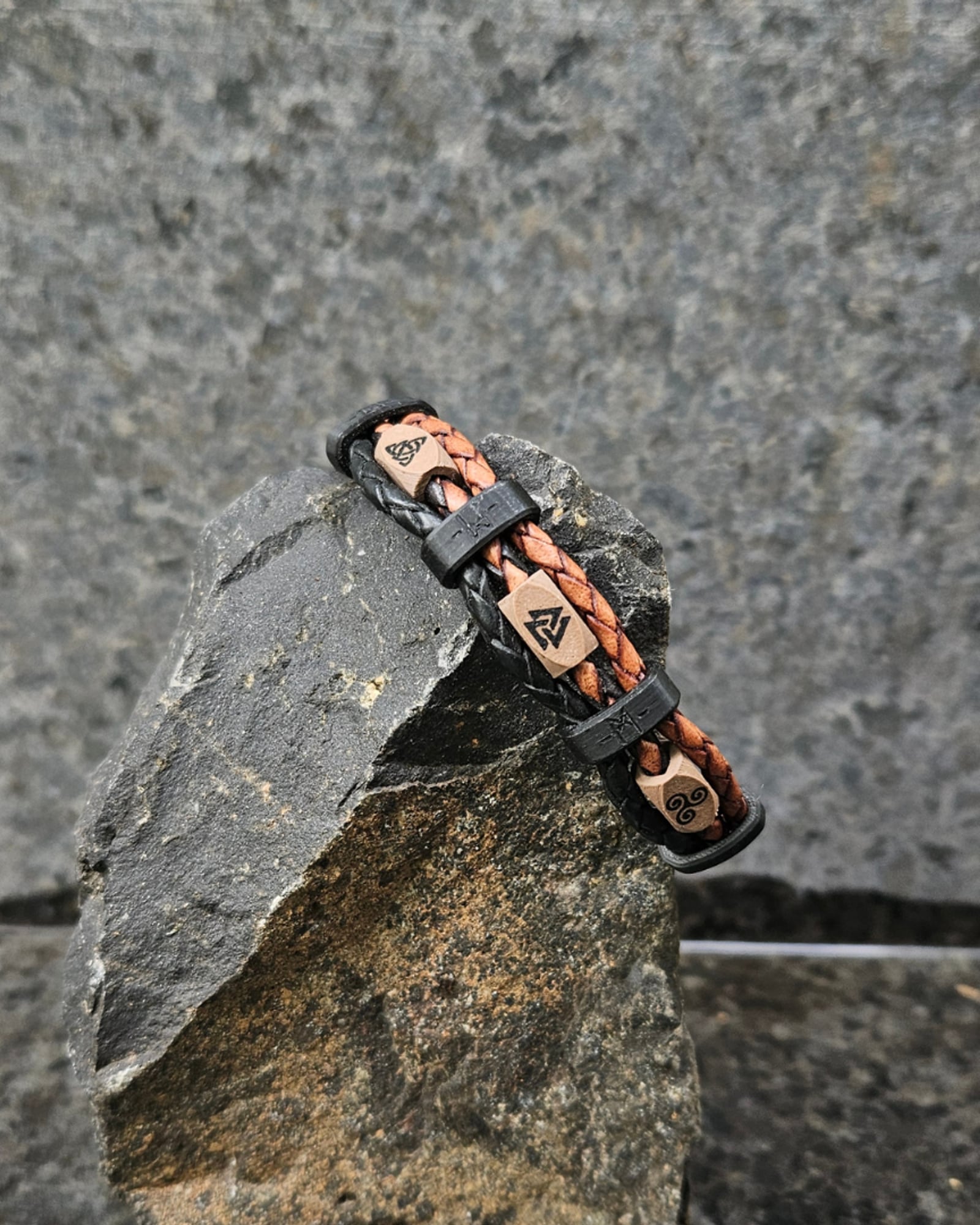 Banded leather band with symbol beads on stone