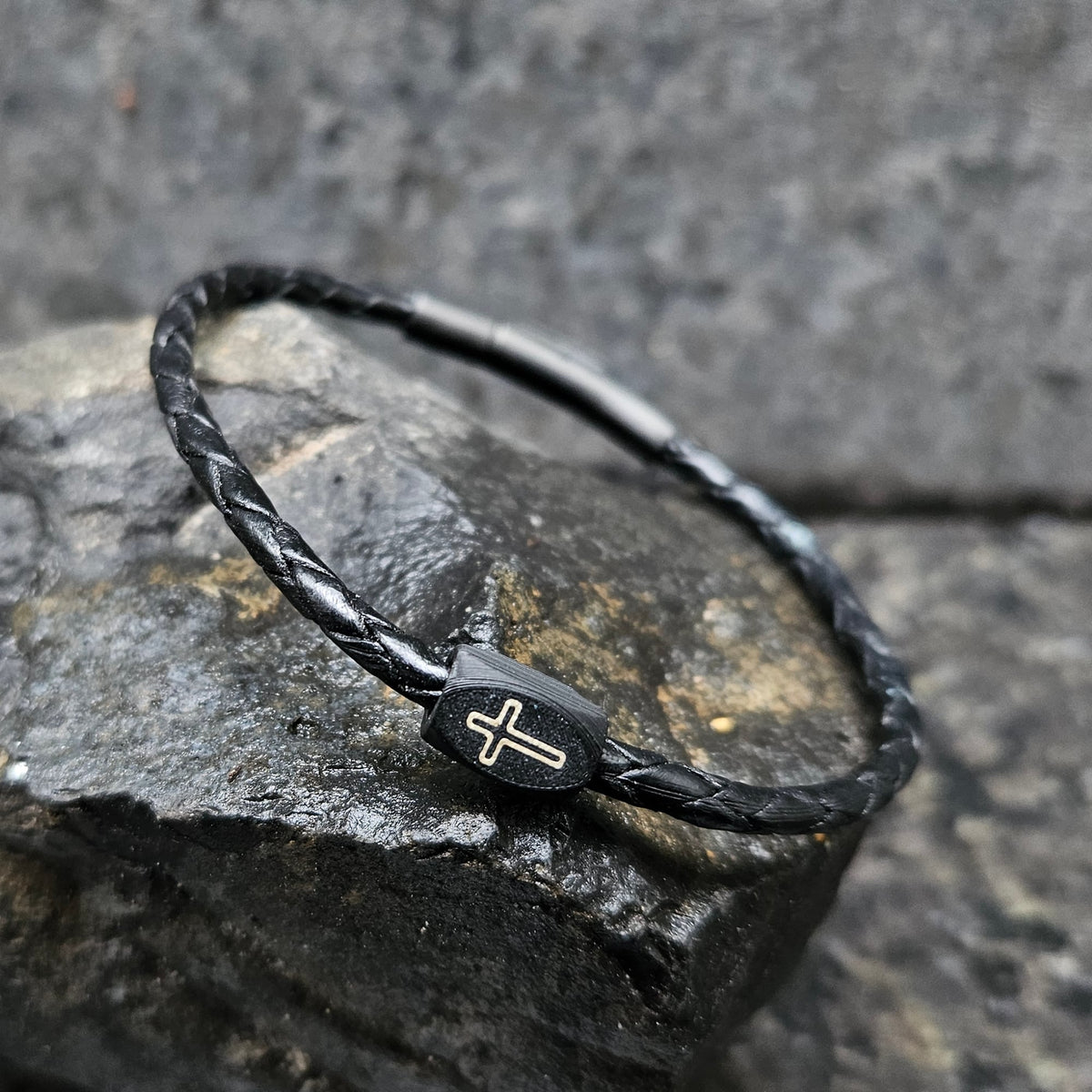 Cross (outline) · Leather Single in Iridium: black leather · black bead · gold outline · black clasp