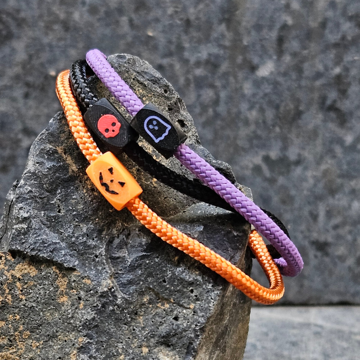 The 2026 Halloween Pack: Ghost, Jack-o-lantern and Skull paracord bands on stone
