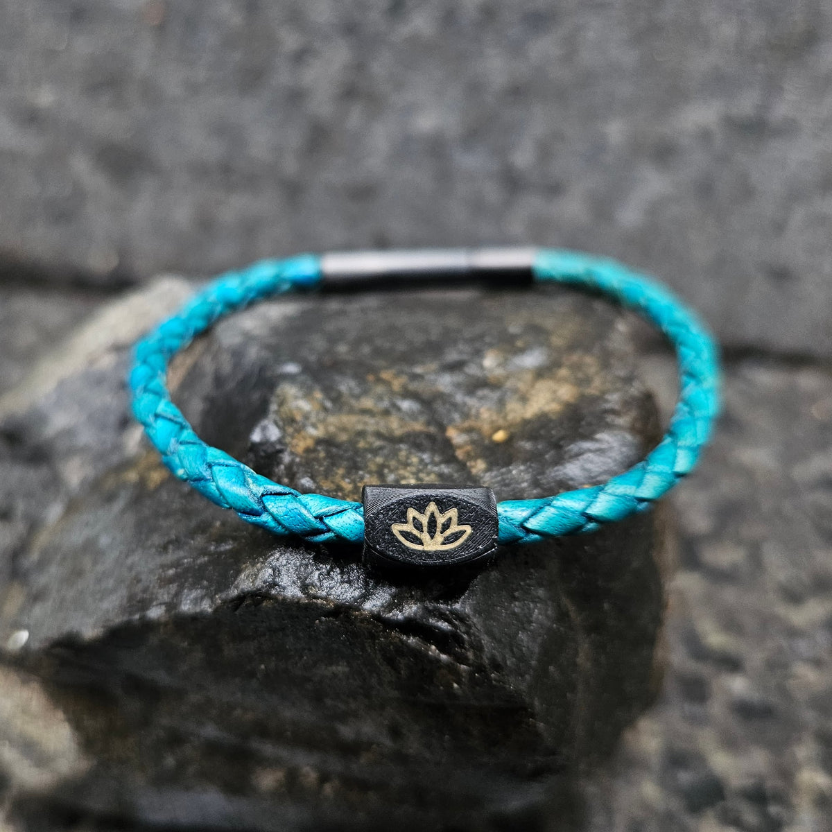 Lotus · Leather Single in Turquoise: turquoise leather · black bead · bronze lotus · black clasp