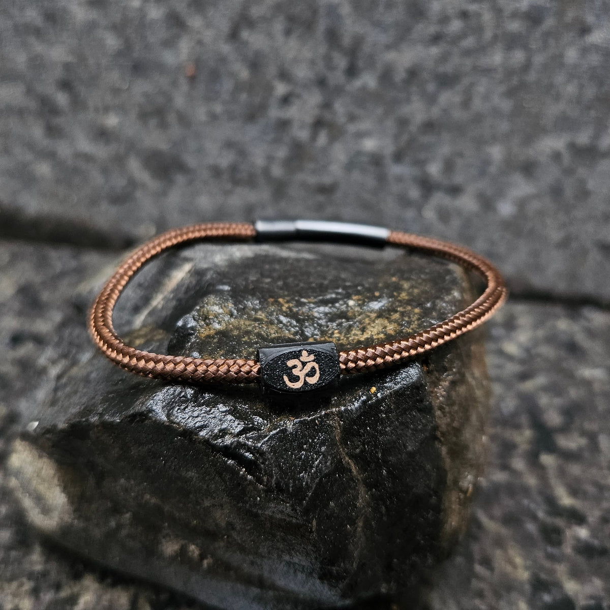 Om · Paracord Single in Tribal: walnut paracord · black bead · brown om · black clasp